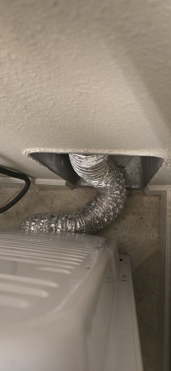 Clean dryer duct properly reconnected behind the dryer